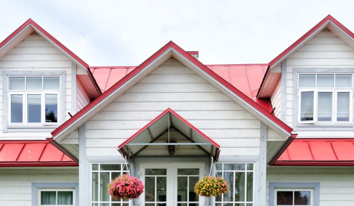 White house with a red metal roof
